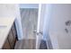 Bathroom with white counters, dark wood cabinets, and vinyl flooring at 247 Brookview Dr, Riverdale, GA 30274