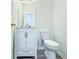 Well-maintained bathroom with modern fixtures, white vanity and toilet with updated flooring at 247 Brookview Dr, Riverdale, GA 30274