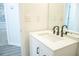 Modern bathroom featuring a new vanity with a black faucet and an updated sink at 247 Brookview Dr, Riverdale, GA 30274