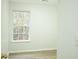 Cozy bedroom with a new window and modern flooring, ready for personalization at 247 Brookview Dr, Riverdale, GA 30274