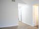Hallway view featuring an open doorway, neutral paint and flooring, and recessed lights at 247 Brookview Dr, Riverdale, GA 30274