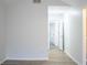 Open hallway area featuring an open doorway, neutral paint and flooring, and recessed lights at 247 Brookview Dr, Riverdale, GA 30274