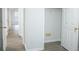 Hallway view featuring a door to the closet with ample storage, neutral paint and flooring at 247 Brookview Dr, Riverdale, GA 30274