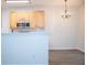Spacious kitchen with breakfast bar area, stainless steel appliances and new light fixture at 247 Brookview Dr, Riverdale, GA 30274