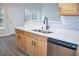 Bright kitchen features stainless steel appliances, white countertops and modern fixtures at 247 Brookview Dr, Riverdale, GA 30274