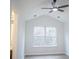 Cozy living area with vaulted ceilings, recessed lights, a ceiling fan and a large window at 247 Brookview Dr, Riverdale, GA 30274
