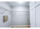 Spacious walk-in closet with wire shelving and wood-look flooring at 247 Brookview Dr, Riverdale, GA 30274