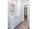 Bathroom boasts a white vanity, drawers, storage cabinet, and modern fixtures at 2598 Elliott Nw St, Atlanta, GA 30318