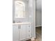 Bright bathroom with modern vanity, mirror, and updated fixtures at 2598 Elliott Nw St, Atlanta, GA 30318