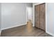 Bedroom features hardwood floors and a closet with bi-fold doors at 2598 Elliott Nw St, Atlanta, GA 30318