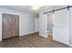 Spacious bedroom with wooden sliding doors and a ceiling fan at 2598 Elliott Nw St, Atlanta, GA 30318