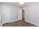 Simple bedroom with ample sunlight and white doors at 2598 Elliott Nw St, Atlanta, GA 30318