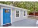 Close up of home's entrance, showcasing a blue front door, white trim, and modern house number at 2598 Elliott Nw St, Atlanta, GA 30318