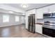 Bright, open kitchen featuring stainless steel appliances and ample cabinet space at 2598 Elliott Nw St, Atlanta, GA 30318
