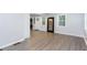 Bright living area with laminate wood flooring, neutral paint, and view of washer and dryer hookups at 2598 Elliott Nw St, Atlanta, GA 30318