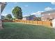 Spacious backyard with a privacy fence and mature trees, perfect for outdoor activities at 359 Interlake Pass, Mcdonough, GA 30252