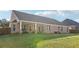 Expansive backyard featuring a covered patio and lush green lawn at 359 Interlake Pass, Mcdonough, GA 30252