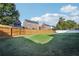 Large grassy backyard enclosed by a wooden privacy fence at 359 Interlake Pass, Mcdonough, GA 30252