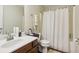 Cozy bathroom with a stylish vanity, modern fixtures, and bathtub shower combo at 359 Interlake Pass, Mcdonough, GA 30252