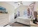 Comfortable bedroom features a vaulted ceiling, cozy bed, and natural light from a window at 359 Interlake Pass, Mcdonough, GA 30252