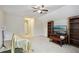 Spacious bonus room showcasing carpet flooring, ceiling fan, and natural light from window at 359 Interlake Pass, Mcdonough, GA 30252