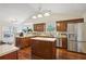 Well-equipped kitchen boasts stainless steel appliances, a central island, and ample counter space at 359 Interlake Pass, Mcdonough, GA 30252