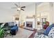 Cozy living room with fireplace, hardwood floors, and an open layout at 359 Interlake Pass, Mcdonough, GA 30252
