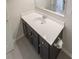 Bathroom showcasing neutral walls, modern sink and vanity with a framed mirror at 404 Providence Walk St, Canton, GA 30114