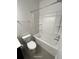 Clean bathroom features a shower-tub combo with a toilet and vanity at 404 Providence Walk St, Canton, GA 30114