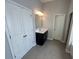 Bathroom showcases a vanity sink with a mirror and lighting at 404 Providence Walk St, Canton, GA 30114