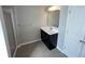 Bathroom featuring modern vanity, framed mirror, and a glass shower with neutral paint and floors at 404 Providence Walk St, Canton, GA 30114