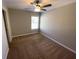 Bedroom featuring neutral paint, carpet and a ceiling fan with bright, natural light at 404 Providence Walk St, Canton, GA 30114