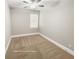 Neutral bedroom features carpet flooring, a ceiling fan, and a window with natural light at 404 Providence Walk St, Canton, GA 30114