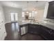 Kitchen island with granite countertop overlooking a cozy living room at 404 Providence Walk St, Canton, GA 30114