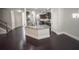 Kitchen island with granite countertop next to living room and stairs at 404 Providence Walk St, Canton, GA 30114