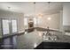 Granite countertop in a kitchen overlooking a cozy living room with fireplace at 404 Providence Walk St, Canton, GA 30114