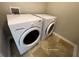 Laundry Room including a new, white front load washer and dryer set at 404 Providence Walk St, Canton, GA 30114