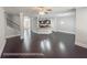 Open-concept living room, dining area, and kitchen with granite countertops and breakfast bar at 404 Providence Walk St, Canton, GA 30114