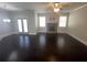 Bright and airy living room with a stone fireplace and French doors at 404 Providence Walk St, Canton, GA 30114