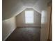 Finished attic space with dormer window, presenting potential for a unique living area at 2319 Browns Mill Se Rd, Atlanta, GA 30315