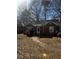 Charming brick home featuring a well-maintained front yard with trees at 2319 Browns Mill Se Rd, Atlanta, GA 30315
