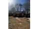 Charming brick home featuring a well-maintained front yard with trees at 2319 Browns Mill Se Rd, Atlanta, GA 30315