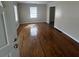 Open living room featuring gleaming hardwood floors at 2319 Browns Mill Se Rd, Atlanta, GA 30315