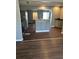 Kitchen and dining area featuring gray cabinets and stainless steel appliances at 6682 Biscayne Blvd, Rex, GA 30273