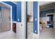 Bathroom featuring a glass shower, vanity and blue walls at 189 Westminster Dr, Atlanta, GA 30309