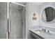 This bathroom features sleek marble countertops and a glass enclosed shower at 189 Westminster Dr, Atlanta, GA 30309