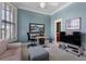 Light and airy bedroom with a ceiling fan, large windows, and a comfortable sitting area, creating a serene retreat at 189 Westminster Dr, Atlanta, GA 30309