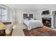 Spacious bedroom featuring a cozy fireplace, a decorative rug, and comfortable seating, creating a relaxing atmosphere at 189 Westminster Dr, Atlanta, GA 30309