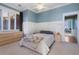 Bedroom with large windows, ceiling fan, and adjacent seating area at 189 Westminster Dr, Atlanta, GA 30309