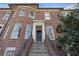 Beautiful brick home featuring a prominent entrance with stone steps and iron railing at 189 Westminster Dr, Atlanta, GA 30309